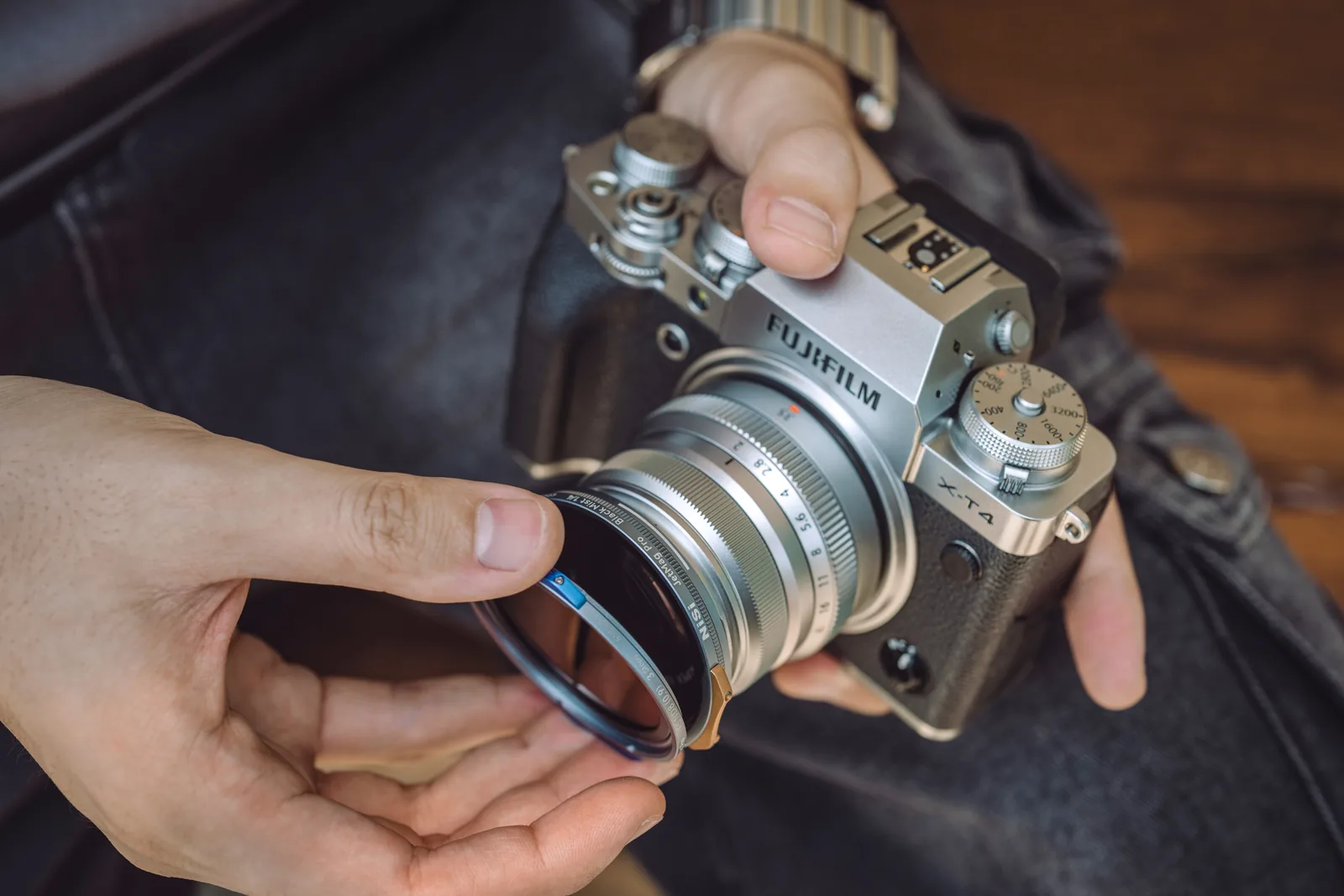 Offering a NiSi JetMag Pro 49MAG adapter ring up to a Fujifilm X-T4 lens