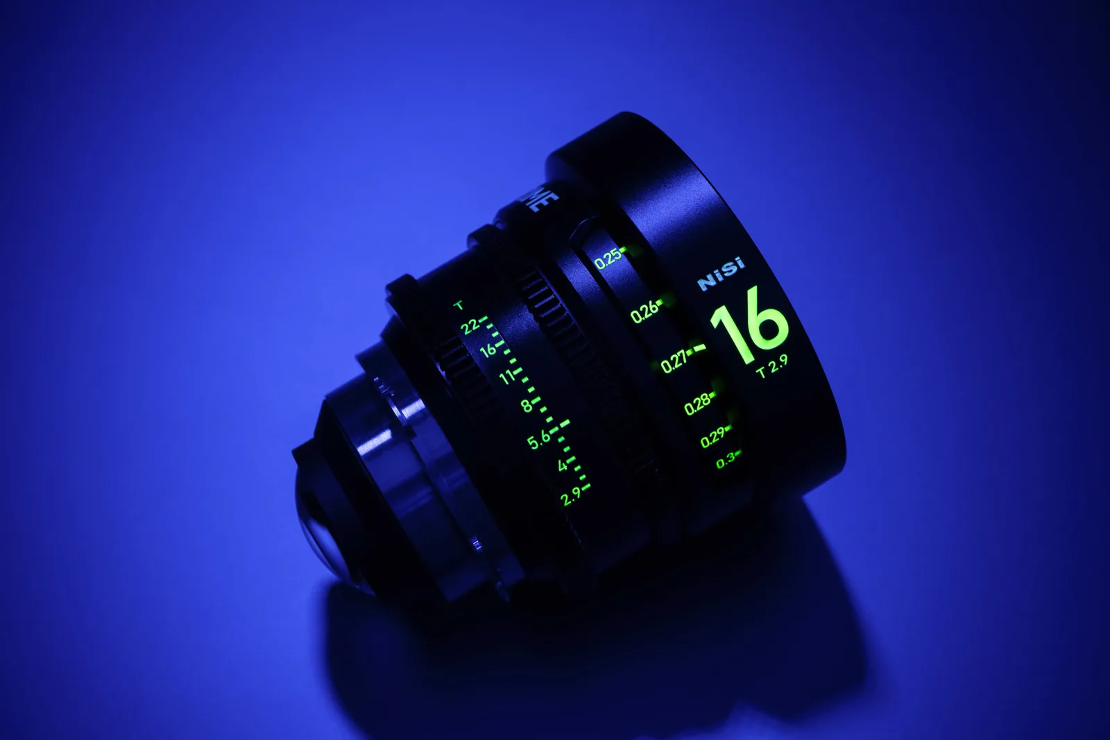 The 65 PRIME 16mm luminescent markings glowing green under blue light