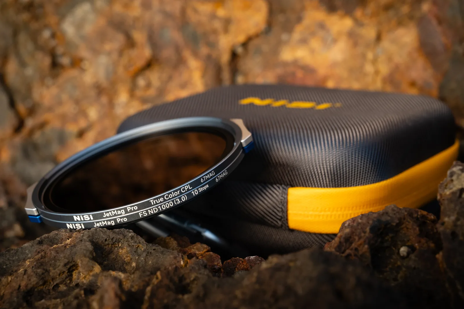 A 67MAG filter resting on the Caddy Pouch on rocks