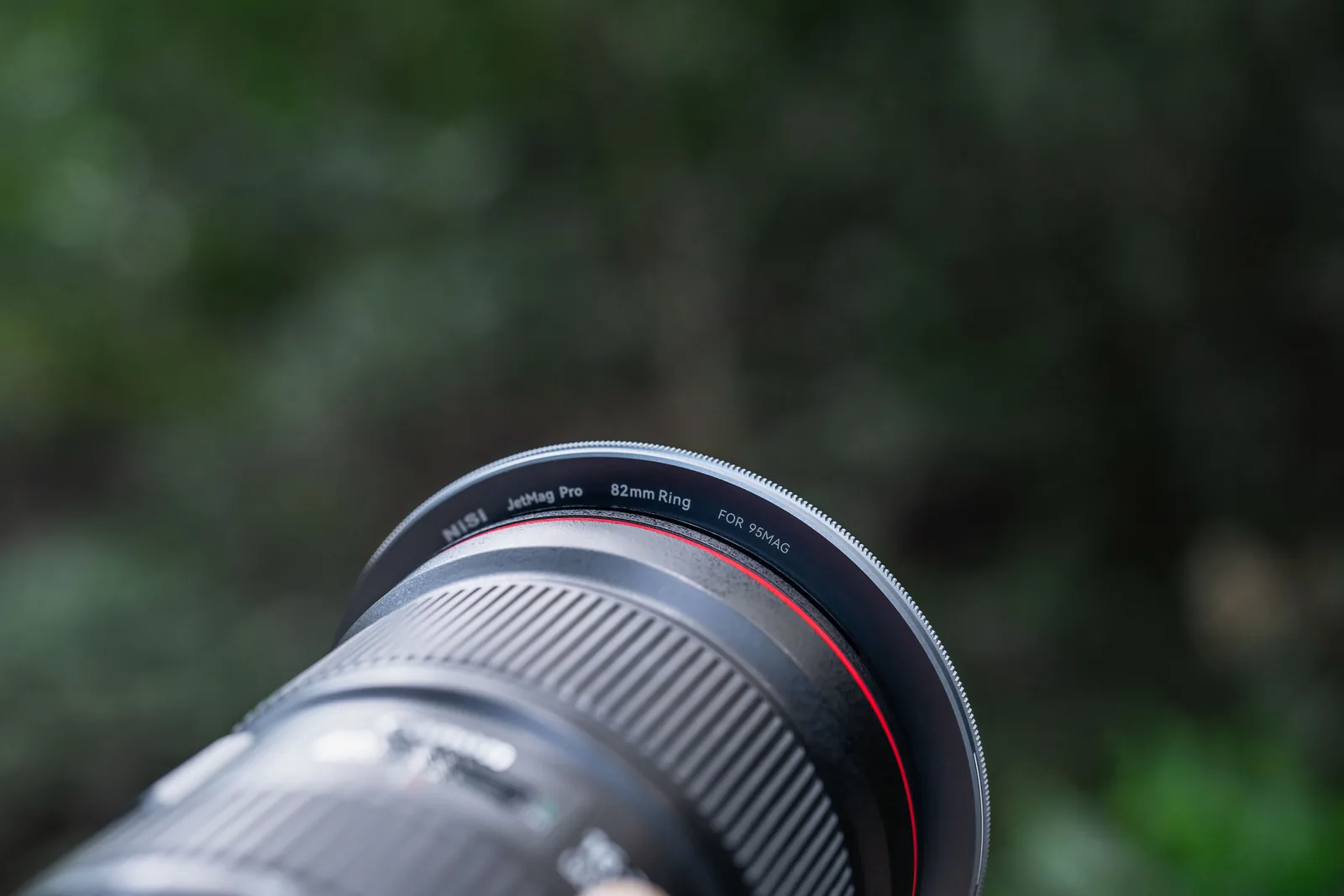 A 95MAG adaptor ring on the front of a large Canon zoom