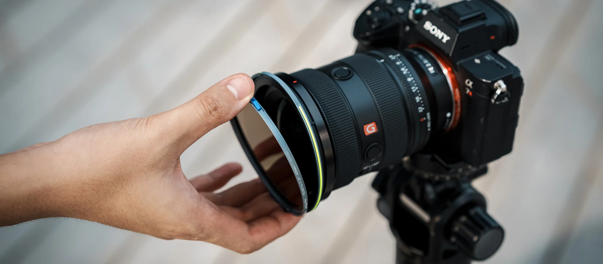 NiSi JetMag Pro 82MAG filter being placed on a Sony camera lens